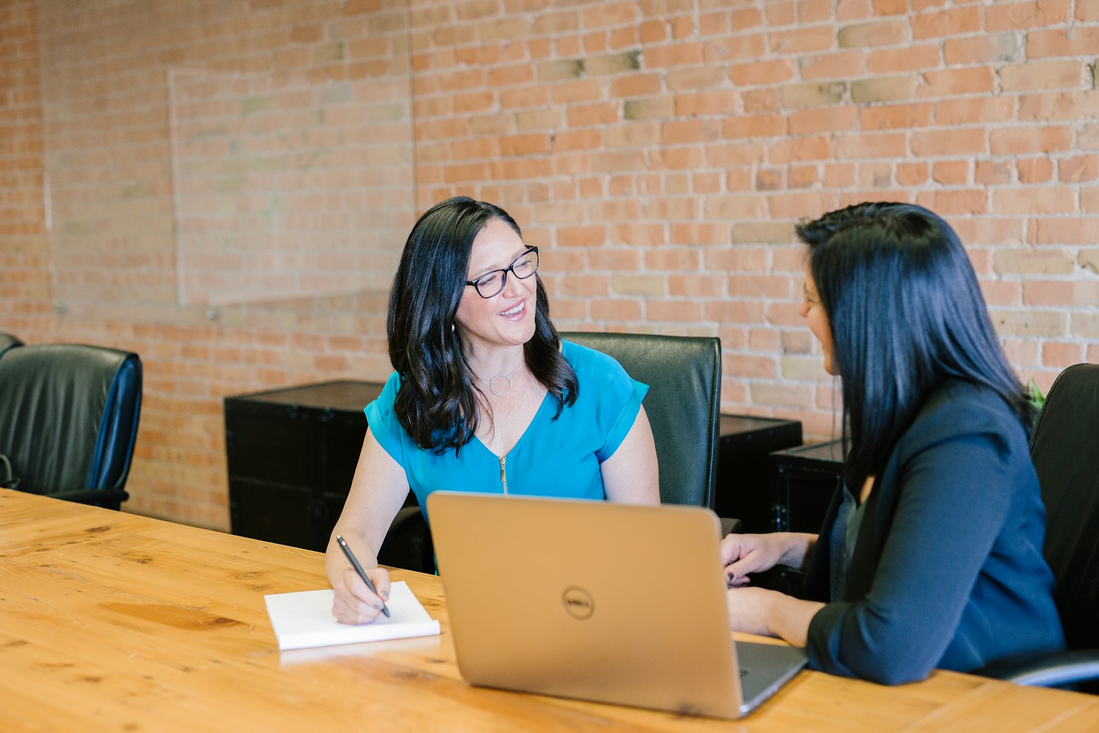Professionals planning a business website around a table